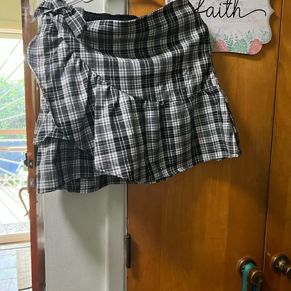 Kidpik Plaid Skirt with attached shorts and bow detail; zipper closure